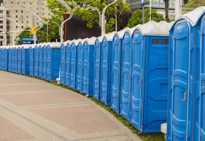 a row of portable restrooms at a fairground, offering visitors a clean and hassle-free experience in piedmont